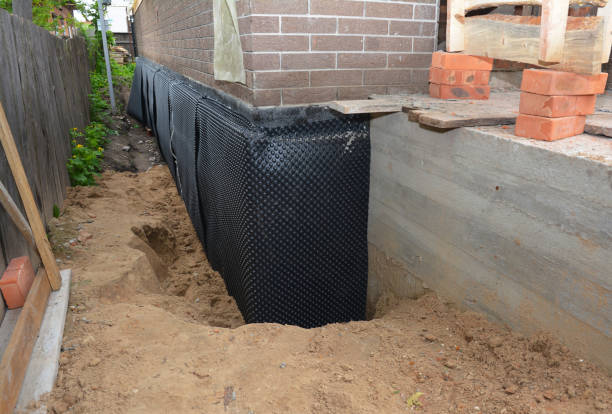 Happy homeowners after waterproofing job in Theodore